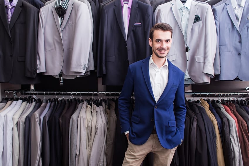 Stylish man choosing high end men's clothing