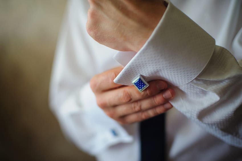 Man wearing cufflinks on a dress shirt sleeve