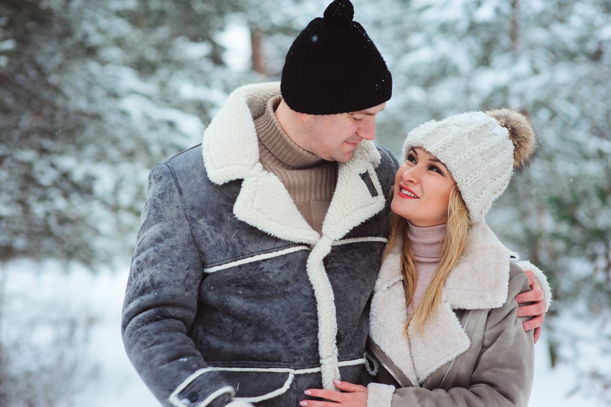 couple-wearing-stylish-layering-attires-outdoors-in-snowy-winter