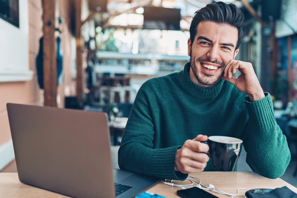 businessman-wearing-a-turtleneck-sweater-in-a-cafeteria