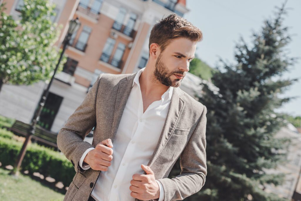 man-standing-in-a-park-going-to-work-during-spring