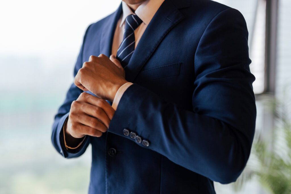 businessman dressing himself at home getting ready for work