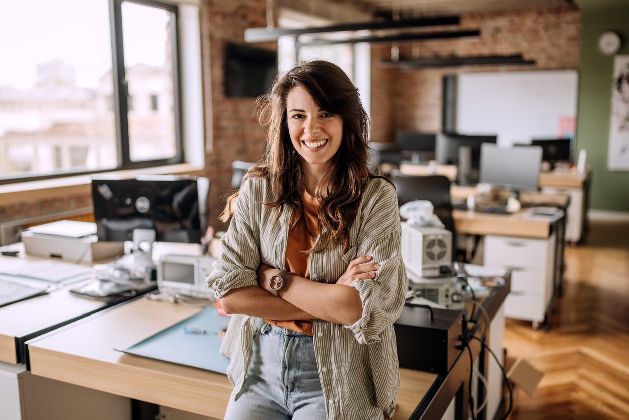 Young beautiful woman in casual wear posing in the office