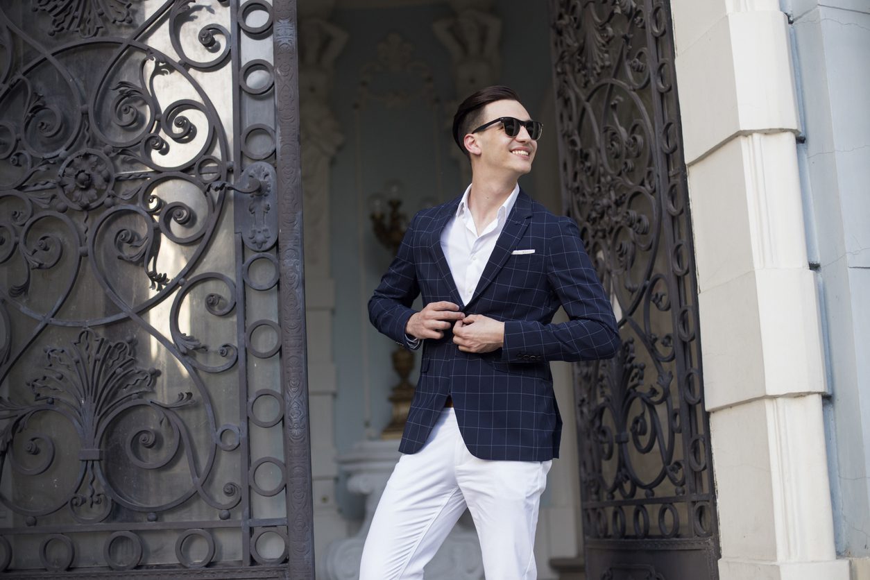 Young man wearing high-fashion business casual attire.